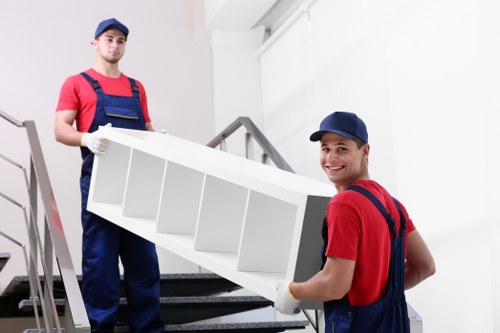 Removal van loading household furniture and boxes for a West London move