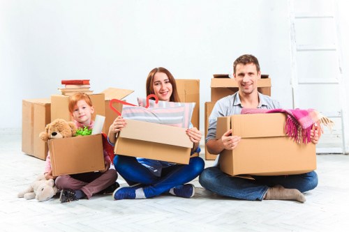 Removal team loading furniture for a flat move in West London