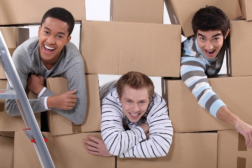 Team preparing boxes and furniture for transport in West London