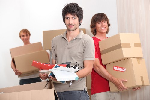 Removal team handling boxes during a house move
