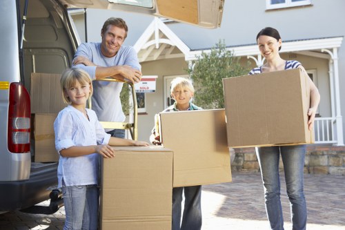 Local house removalists unloading items at a West London property