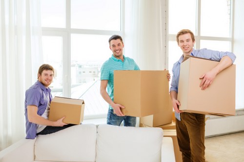 Packed moving boxes and furniture ready for transport in West London