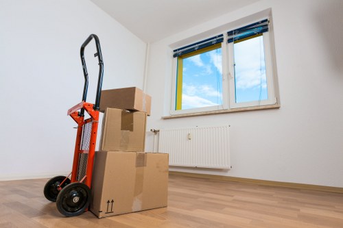 Furniture being carried down stairs during a house move