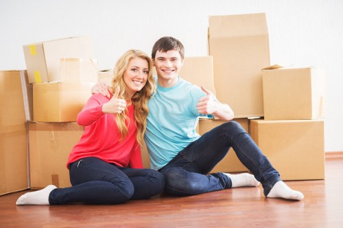 Movers loading household items during a West London relocation