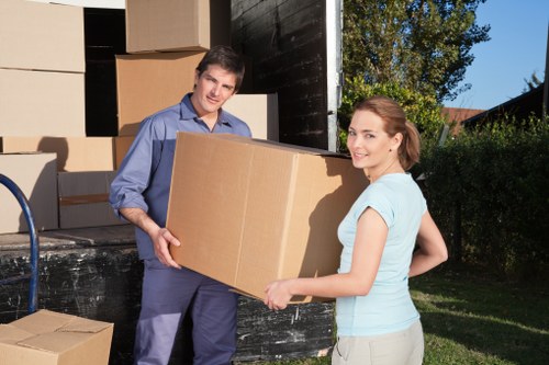 Packed office furniture and equipment ready for transport in West London