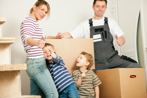 Packed boxes and moving supplies ready for a flat removal in West London
